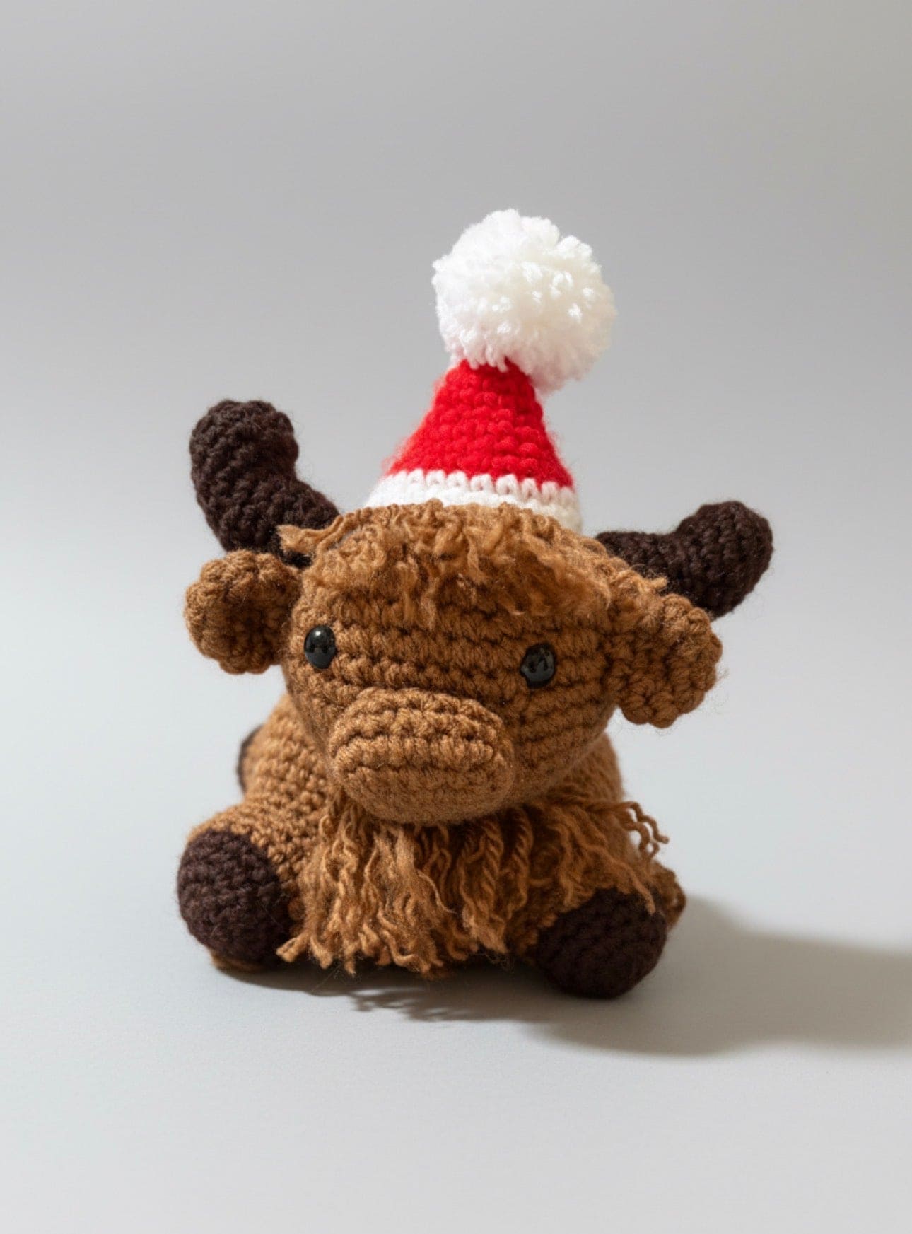 "Meet Harlow: The Adorable Christmas Themed Crocheted Highland Cow!"