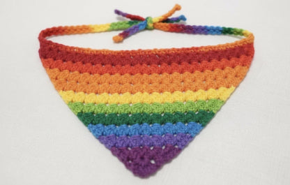 Crocheted rainbow bandana on a white background