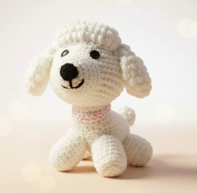 White crochet dog toy on a light background