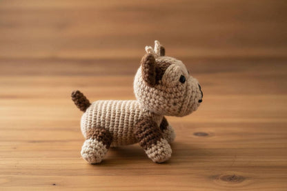 Crocheted dog on a wooden surface